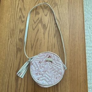 Justice Girls shoulder bag. Small seam flaw on inside of shoulder strap.